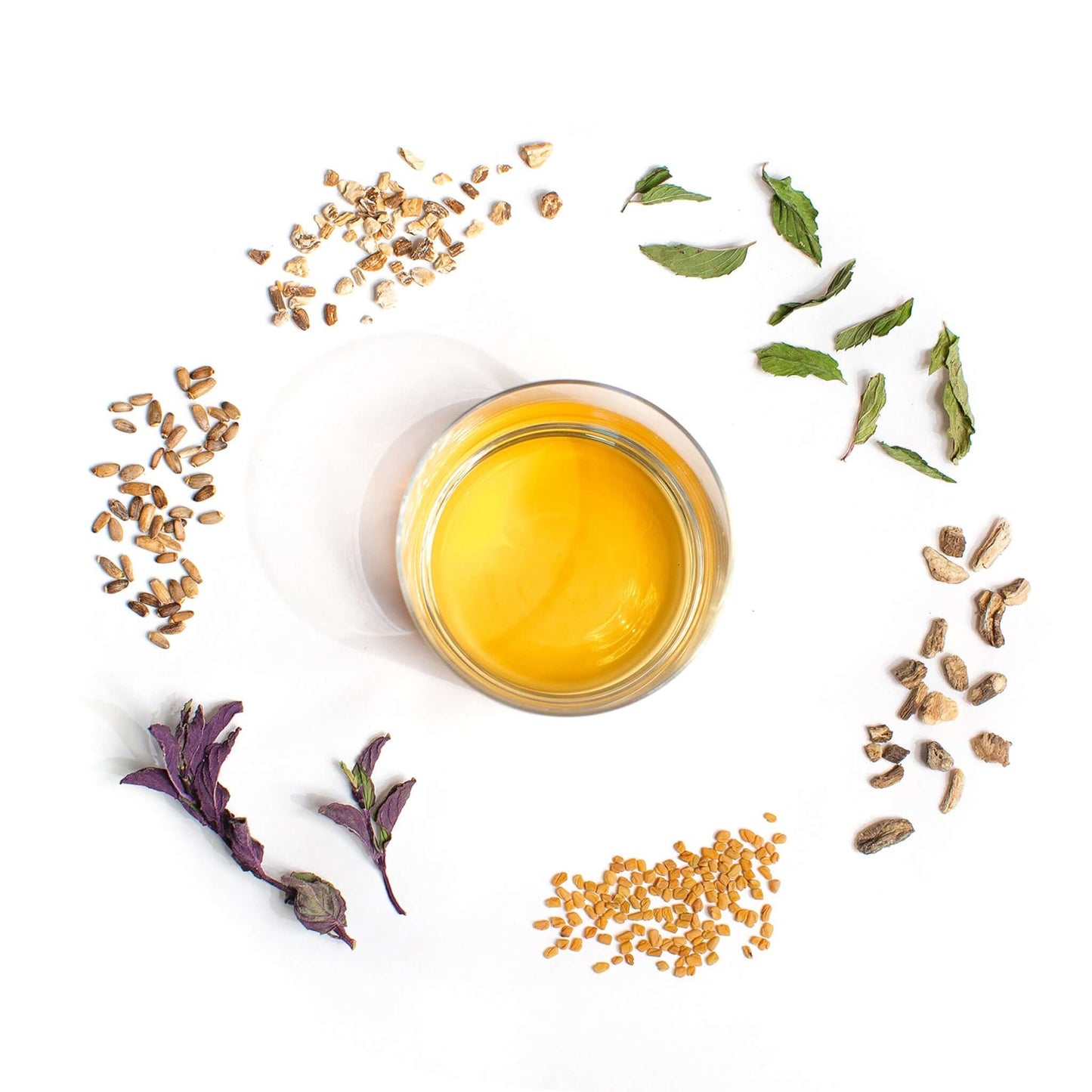 Organic Women's Cleanse Herbal Tea Blend shown with tea and herbs