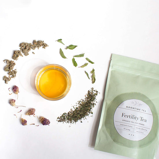 Organic Women's Fertility Herbal Tea Blend with herbs and packaging